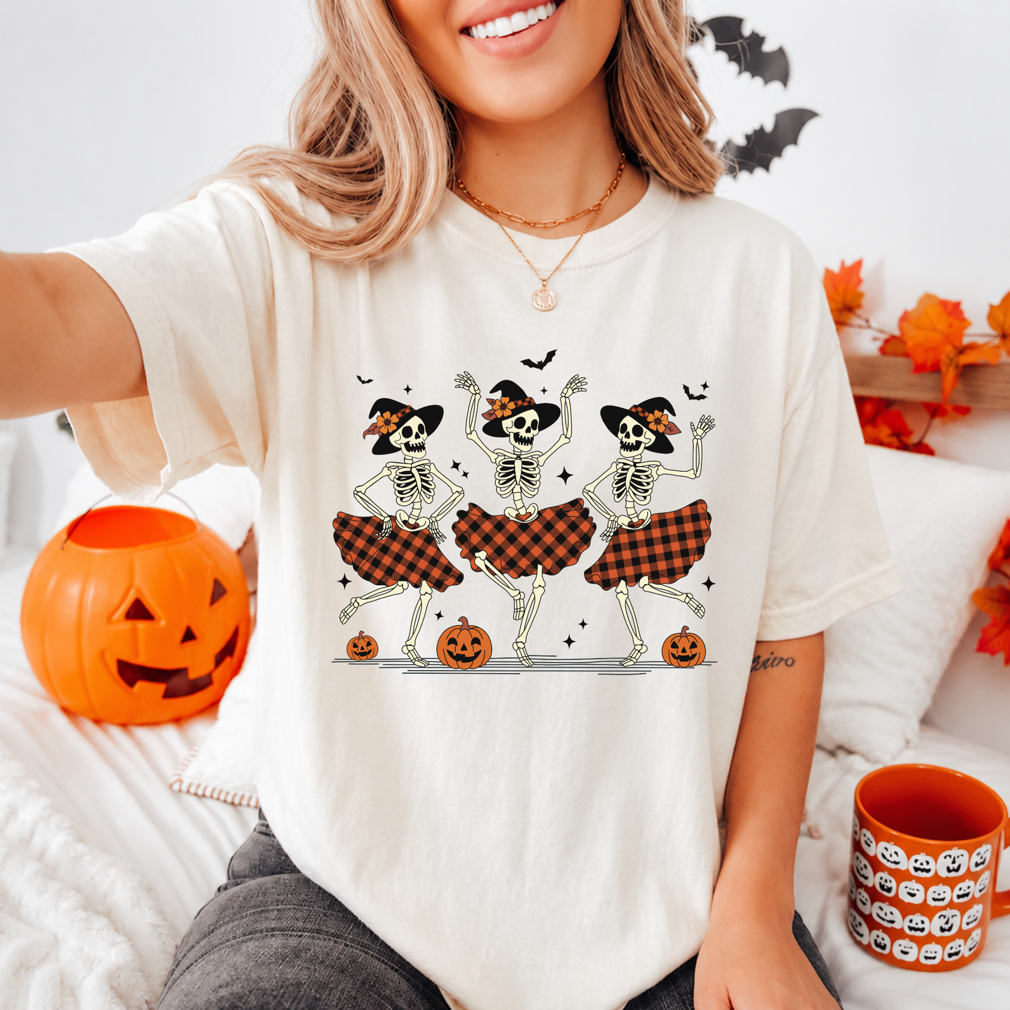 Close-up of the vintage distressed retro dancing skeletons print on a Comfort Colors t-shirt.