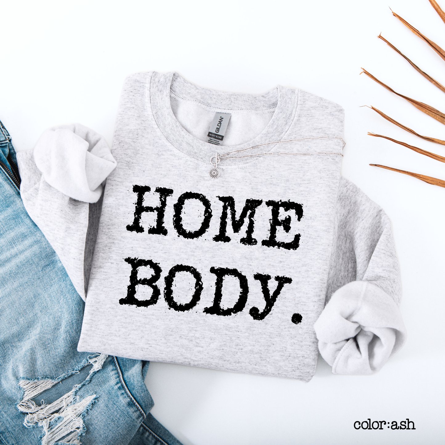 Gray sweatshirt with 'HOME BODY.' text on a white background